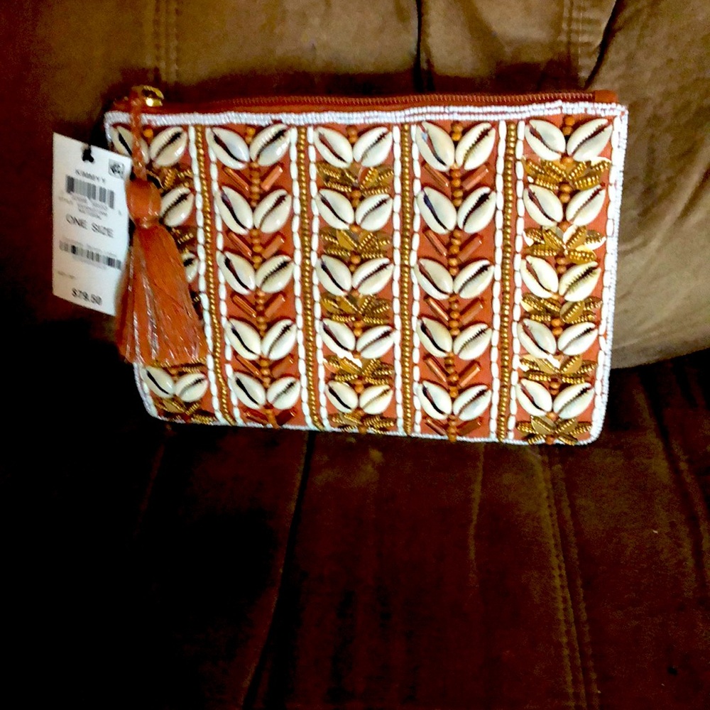 Kimmy brand; natural color brand new, never used handbag.